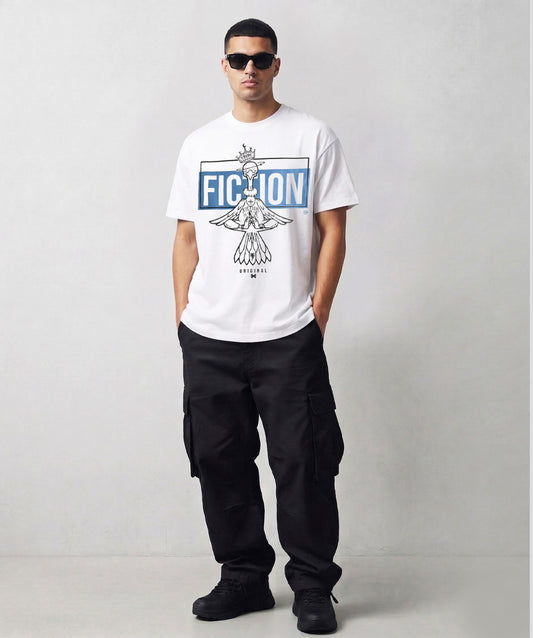 Person wearing a Tribe Fiction "At Peace" white t-shirt featuring a meditating bird graphic design