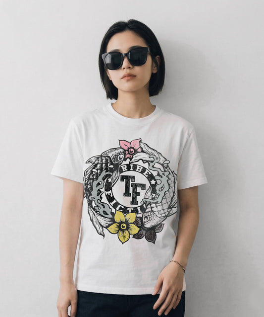 Person wearing a Tribe Fiction "Koi Fish" white t-shirt featuring a koi fish graphic design