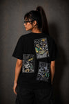 Model wearing the Moo and Mamboo 2 black t-shirt, back view showing the three-panel print