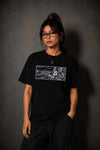 Model wearing the Moo and Mamboo 2 black t-shirt, front view