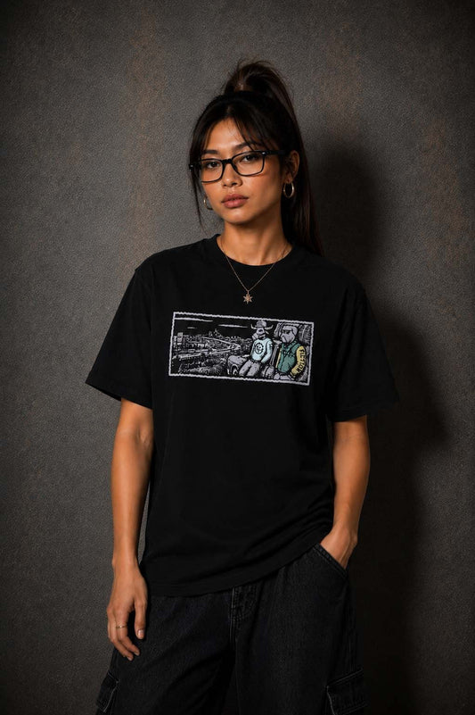 Model wearing the Moo and Mamboo 2 black t-shirt, front view