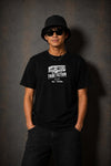 Model wearing the Moo and Mamboo 3 black t-shirt, front view